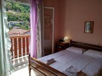 Postel nebo postele na pokoji v ubytování Aggelos House in Kalamitsi