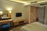 A bed or beds in a room at Hotel Tyulenovo