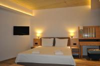 A bed or beds in a room at Hotel Tyulenovo