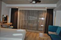 A bed or beds in a room at Hotel Tyulenovo