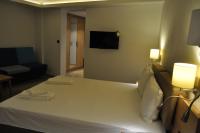 A bed or beds in a room at Hotel Tyulenovo