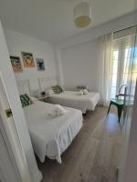 A bed or beds in a room at TOP APARTMENT! Frente al mar y gran terraza