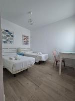 A bed or beds in a room at TOP APARTMENT! Frente al mar y gran terraza