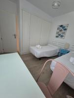 A bed or beds in a room at TOP APARTMENT! Frente al mar y gran terraza