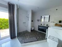 Televízia a/alebo spoločenská miestnosť v ubytovaní Appartement Villa d'Aurore