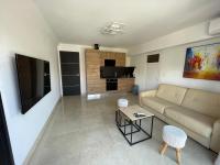 Televízia a/alebo spoločenská miestnosť v ubytovaní Appartement Villa d'Aurore