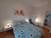 Łóżko lub łóżka w pokoju w obiekcie Apartmani PARADISO