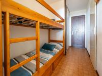 a bunk bed room with two bunk beds at Apartment Les Eaux Vives 1 &amp; 2-5 by Interhome in Saint Pierre La Mer