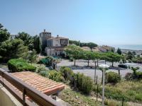 a view from a balcony of a house and a parking lot at Apartment Les Eaux Vives 1 &amp; 2-5 by Interhome in Saint Pierre La Mer