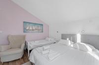 Łóżko lub łóżka w pokoju w obiekcie Apartments Petrina