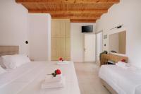 A bed or beds in a room at Santos Holidays