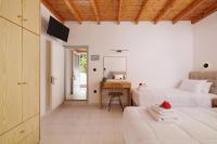 A bed or beds in a room at Santos Holidays