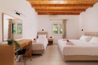 A bed or beds in a room at Santos Holidays
