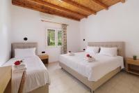 A bed or beds in a room at Santos Holidays