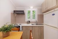 A kitchen or kitchenette at Santos Holidays
