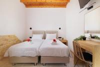 A bed or beds in a room at Santos Holidays