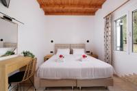 A bed or beds in a room at Santos Holidays