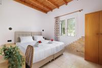 A bed or beds in a room at Santos Holidays