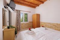 A bed or beds in a room at Santos Holidays