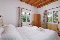 A bed or beds in a room at Santos Holidays