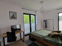 Łóżko lub łóżka w pokoju w obiekcie Apartament rodzinny Słoneczna Sosnówka