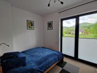 Łóżko lub łóżka w pokoju w obiekcie Apartament rodzinny Słoneczna Sosnówka