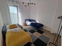 Łóżko lub łóżka w pokoju w obiekcie Apartament rodzinny Słoneczna Sosnówka