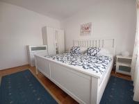 Postel nebo postele na pokoji v ubytování Apartments Simona
