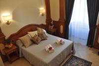 A bed or beds in a room at Rome Imperial Crown