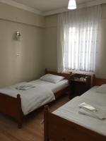Postel nebo postele na pokoji v ubytování KOÇAN OTEL Hatice Karakoçan
