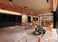 Un restaurante con mesas y sillas y un comedor. en ibis Styles Lisboa Aeroporto, en Lisboa