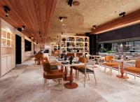 Un restaurante con techos de madera y mesas y sillas. en ibis Styles Lisboa Aeroporto, en Lisboa