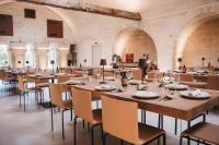 a large dining room with tables and chairs at MASSERIA ACQUASALE - RELAIS & RESTAURANT in San Giorgio Ionico