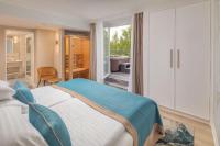 Łóżko lub łóżka w pokoju w obiekcie Lotus Therme Hotel & Spa