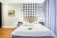 Posteľ alebo postele v izbe v ubytovaní Triton Park Apartments