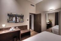 A bed or beds in a room at Hotel Concord
