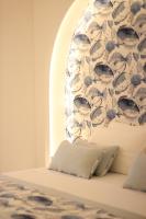 A bed or beds in a room at Il Borghetto Resort & Spa