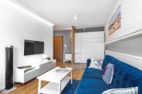 Telewizja i/lub zestaw kina domowego w obiekcie Unique Apartments - Angielska Grobla