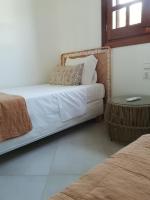 Posteľ alebo postele v izbe v ubytovaní private beachfront house