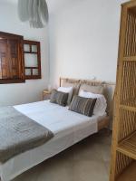 Posteľ alebo postele v izbe v ubytovaní private beachfront house