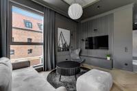 Televízia a/alebo spoločenská miestnosť v ubytovaní Comfort Apartments Granaria