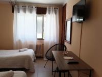 Postel nebo postele na pokoji v ubytování Hostal Pensión Mar de Plata