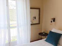 Postel nebo postele na pokoji v ubytování Hostal Pensión Mar de Plata