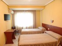 Postel nebo postele na pokoji v ubytování Hostal Athlanta