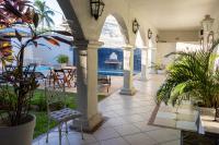 an outdoor patio with a view of the water at Pousada Boulevard in Cabo Frio