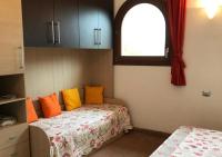A bed or beds in a room at Casa Katia, Giuliana & Nami
