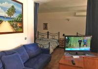A television and/or entertainment centre at Casa Katia, Giuliana & Nami