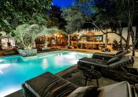 a swimming pool in a backyard with a house at Una Vida in Tulum