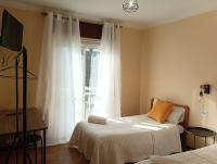 Postel nebo postele na pokoji v ubytování Hostal Pensión Mar de Plata