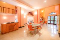 a kitchen and dining room with a table and chairs at Starry Boutique in Kandy